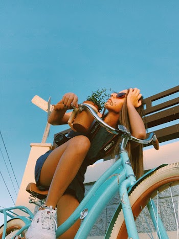 Woman Leaning on Bicycle