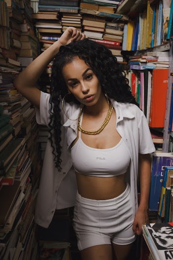 Woman Leaning on Books