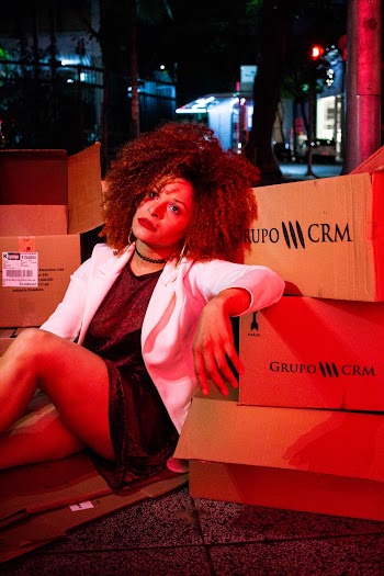 Woman Leaning on Box