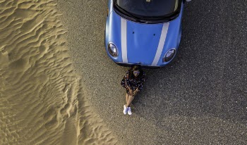 Woman Leaning on Car