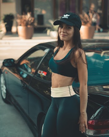 Woman Leaning On Car