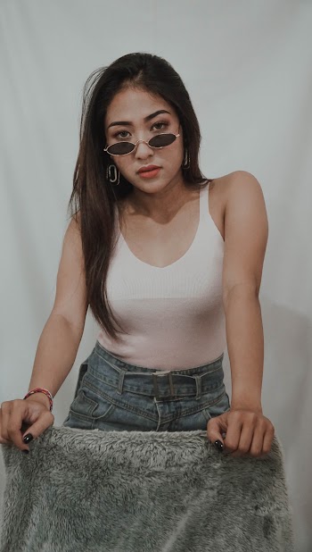 Woman Leaning on Chair