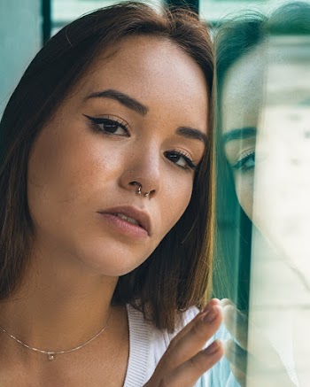 Woman Leaning On Clear Glass