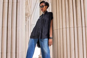 woman leaning on concrete pedestal column