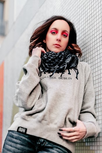 Woman Leaning on Concrete Wall