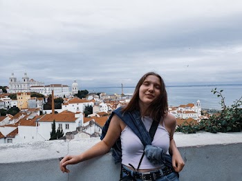 Woman Leaning on Concrete Wall