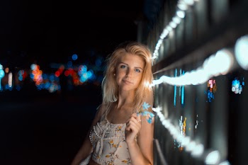 Woman Leaning on Fence