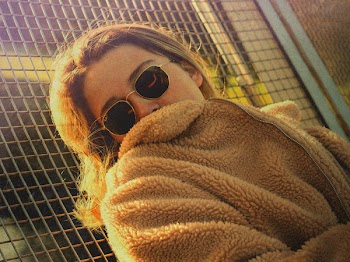 Woman Leaning on Fence