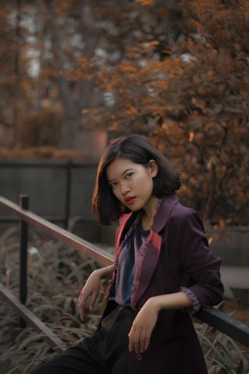 Woman Leaning on Fence