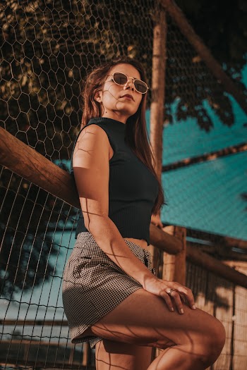 Woman Leaning On Fence