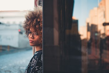 Woman Leaning on Glass