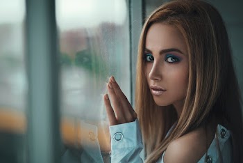 Woman Leaning on Glass Window