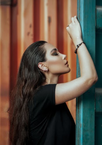 Woman Leaning on Green Frame