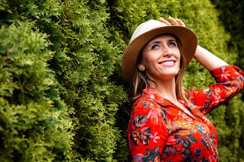 Woman Leaning on Green Grass