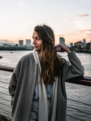 Woman Leaning on Handrail
