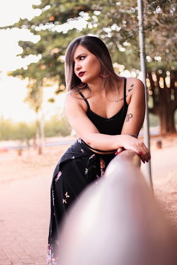 Woman Leaning on Handrail