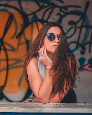 Woman Leaning on Hear Hand