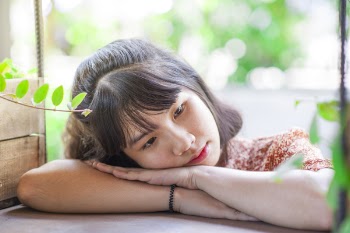 Woman Leaning on Her Hands