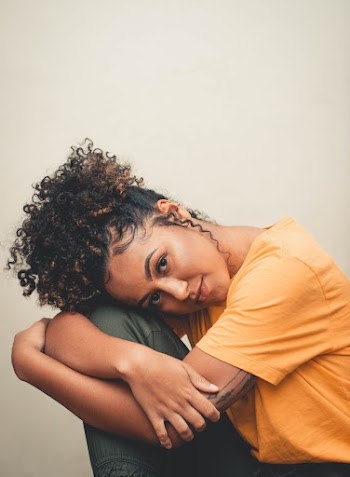 Woman Leaning on Her Knee