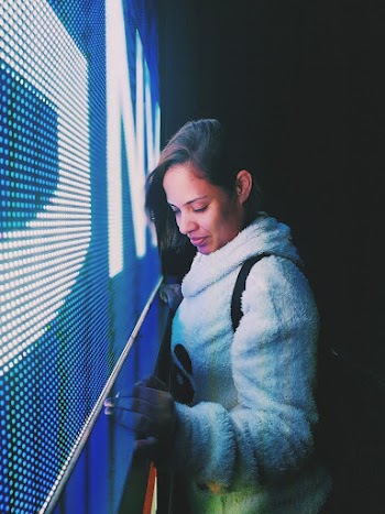Woman Leaning on Led Monitor