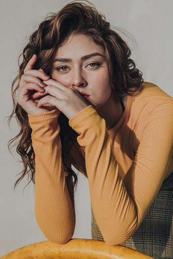 Woman Leaning on Metal