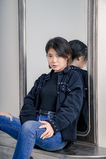 Woman Leaning on Mirror