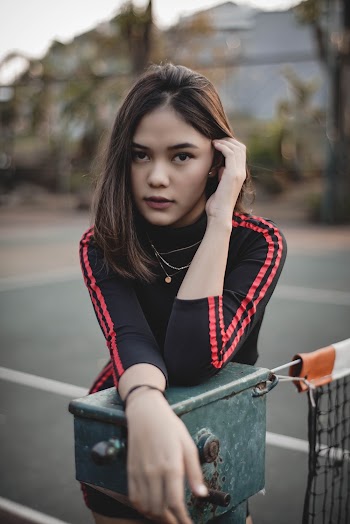 Woman Leaning on Net