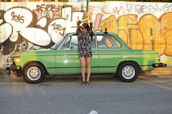 Woman Leaning on Parked Car