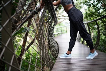 Woman Leaning on Pathway Rail
