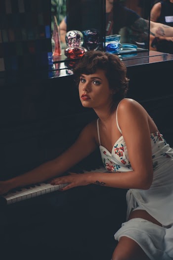 Woman Leaning on Piano