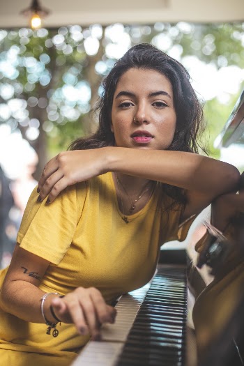 Woman Leaning on Piano