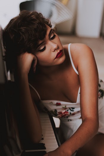 Woman Leaning on Piano Organ