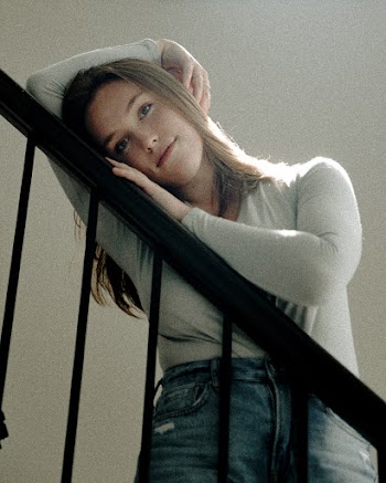 Woman Leaning on Railing