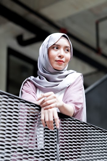 Woman Leaning on Railing