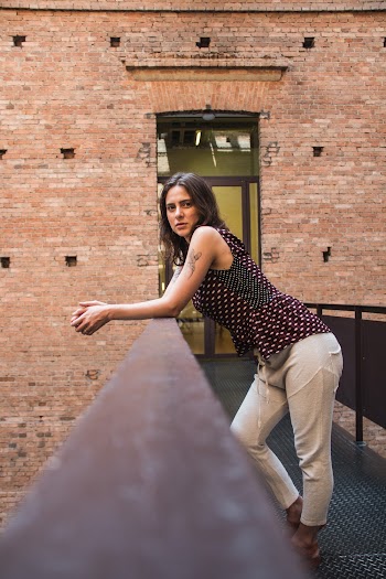 Woman Leaning on Railing