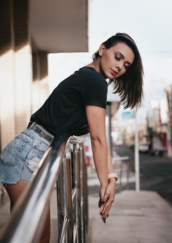 Woman Leaning on Railing