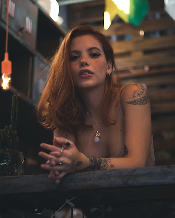 Woman Leaning on Table