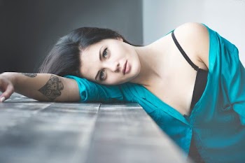 woman leaning on table