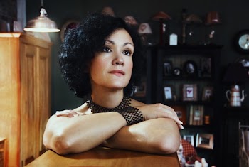 Woman Leaning on Table