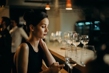 Woman Leaning on Table