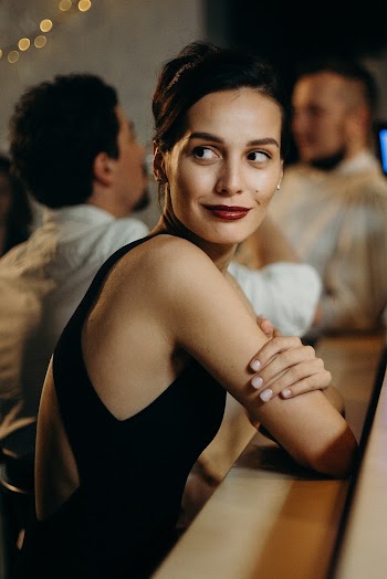 Woman Leaning on Table