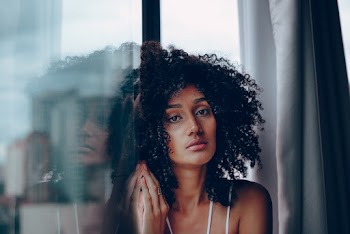 Woman Leaning on the Glass