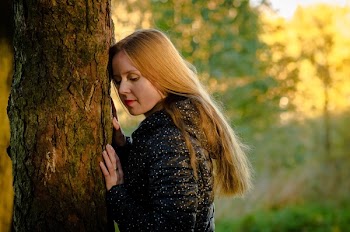 Woman Leaning on the Tree