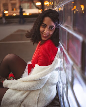 Woman Leaning on Wall