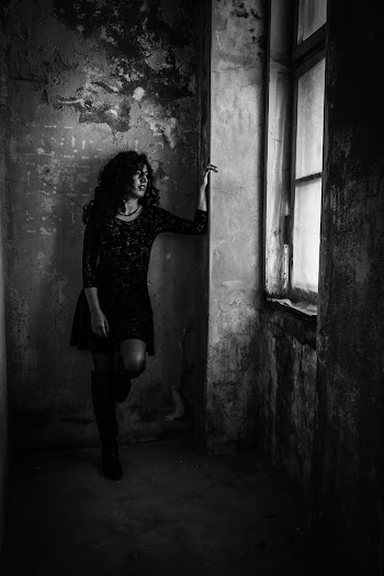 Woman Leaning on Wall