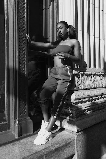 Woman Leaning on Wall