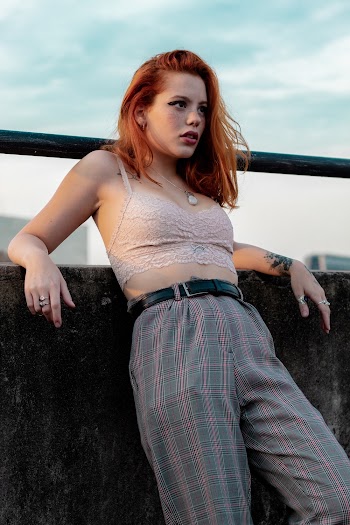 Woman Leaning On Wall