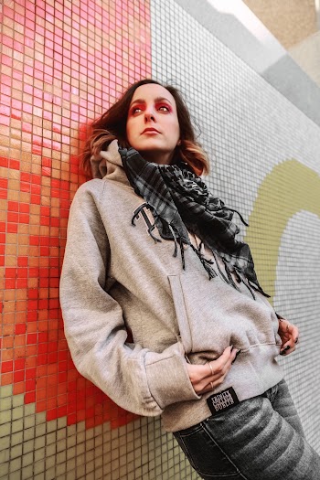 Woman Leaning On Wall