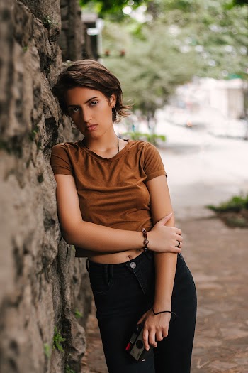 Woman Leaning On Wall