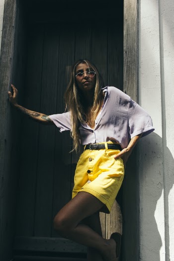 Woman Leaning on Wall